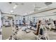 Well-equipped fitness center with treadmills, elliptical machines, weight machines, and ample natural light at 7493 S Quail Cir # 928, Littleton, CO 80127