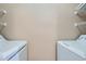 Laundry area featuring a white washer and dryer at 7493 S Quail Cir # 928, Littleton, CO 80127