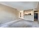 Open-concept living room flowing into the kitchen at 7493 S Quail Cir # 928, Littleton, CO 80127