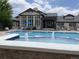 Inviting community pool with water features and comfortable lounge area, perfect for summer enjoyment at 7493 S Quail Cir # 928, Littleton, CO 80127