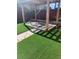 Relaxing backyard with artificial turf, custom pergola, and a comfortable hammock chair for ultimate relaxation at 3270 Depew St, Wheat Ridge, CO 80212