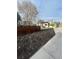 Recently mulched landscaping in backyard, and a pergola-covered patio for summer entertaining at 3270 Depew St, Wheat Ridge, CO 80212