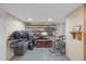 Finished basement with shelving provides additional storage for bikes and other items at 3270 Depew St, Wheat Ridge, CO 80212