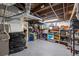 Unfinished basement with exposed ceiling, concrete floor, and ample storage space at 3270 Depew St, Wheat Ridge, CO 80212
