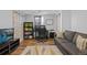 Home office featuring a desk, bookcase, and comfortable seating area with natural light from the windows at 3270 Depew St, Wheat Ridge, CO 80212
