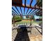 Inviting patio with pergola and outdoor dining area, perfect for entertaining guests in a stylish and comfortable setting at 3270 Depew St, Wheat Ridge, CO 80212