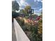 Charming yard with a flower bed, blooming roses, and a basketball hoop for Gathering fun and outdoor activities at 3270 Depew St, Wheat Ridge, CO 80212