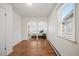 Bedroom with hardwood floors, archway to another room, and a window at 4731 S Acoma St, Englewood, CO 80110
