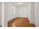 Bedroom with hardwood floors, ample sunlight and a closet at 4731 S Acoma St, Englewood, CO 80110