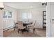 Bright dining room with seating for four and a large window for ample natural light at 4731 S Acoma St, Englewood, CO 80110
