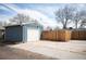 A detached one car garage provides secure parking and extra storage space, with a gated area for further parking at 4731 S Acoma St, Englewood, CO 80110