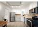 Updated kitchen featuring stainless steel appliances, ample lighting, and ample counter space at 4731 S Acoma St, Englewood, CO 80110