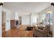 Spacious living room offering natural light and beautiful hardwood floors, open to a dining area at 4731 S Acoma St, Englewood, CO 80110