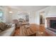 Inviting living space featuring hardwood floors, fireplace, and seamless flow to dining and kitchen areas at 4731 S Acoma St, Englewood, CO 80110