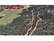An aerial view of the property lines and surrounding trees at 13525 Woodmoor West Dr, Larkspur, CO 80118