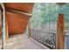 Private balcony features wooded views and an animal themed railing at 13525 Woodmoor West Dr, Larkspur, CO 80118