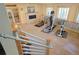 Finished basement featuring exercise equipment, carpeted floor, and stone fireplace at 13525 Woodmoor West Dr, Larkspur, CO 80118