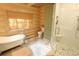 Bathroom features a claw foot bathtub, a walk-in glass shower, a toilet and storage, all inside a wooden interior at 13525 Woodmoor West Dr, Larkspur, CO 80118