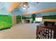 Fun vaulted bedroom with mural decor and exposed beam details at 13525 Woodmoor West Dr, Larkspur, CO 80118