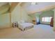 Vaulted bedroom with exposed beams, a ceiling fan, and natural light at 13525 Woodmoor West Dr, Larkspur, CO 80118