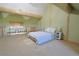 Vaulted bedroom with exposed beams, a ceiling fan, and natural light at 13525 Woodmoor West Dr, Larkspur, CO 80118