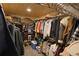Spacious walk-in closet with custom shelving and plenty of room for clothing and storage at 13525 Woodmoor West Dr, Larkspur, CO 80118