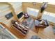 Bright and airy log home living room with hardwood floors, vaulted ceilings, and comfortable furnishings at 13525 Woodmoor West Dr, Larkspur, CO 80118