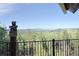 Enjoy breathtaking mountain views from this property's charming outdoor porch at 13525 Woodmoor West Dr, Larkspur, CO 80118