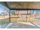 Covered back porch with view of the home's backyard at 7649 E Amherst Ave, Denver, CO 80231