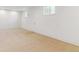 Finished basement room with a neutral carpet, and two windows at 7649 E Amherst Ave, Denver, CO 80231
