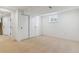 Finished basement room featuring neutral carpet, a window, and closet at 7649 E Amherst Ave, Denver, CO 80231