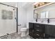 Modern bathroom featuring a double vanity, subway tile shower, and stylish fixtures at 7649 E Amherst Ave, Denver, CO 80231