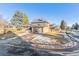 Charming two-story home featuring an attached garage, brick accents, and well-maintained landscaping in a suburban neighborhood at 7649 E Amherst Ave, Denver, CO 80231