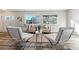 Well-lit living room with hardwood floors, modern seating, and large windows overlooking the yard at 7649 E Amherst Ave, Denver, CO 80231