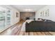 Inviting living room featuring wood floors, fireplace, and access to outdoor area at 7649 E Amherst Ave, Denver, CO 80231