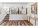 Open living space with stairs leading to the kitchen and dining area at 7649 E Amherst Ave, Denver, CO 80231