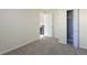 Comfortable carpeted bedroom featuring a built in closet and good natural lighting at 17325 E Rice Cir # F, Aurora, CO 80015