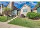 Charming multi-level home with a well-maintained front lawn and inviting entryway at 17325 E Rice Cir # F, Aurora, CO 80015