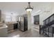 Modern eat-in kitchen featuring stainless steel appliances and an adjoining living room at 17325 E Rice Cir # F, Aurora, CO 80015