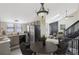 Modern eat-in kitchen featuring stainless steel appliances and an adjoining living room at 17325 E Rice Cir # F, Aurora, CO 80015