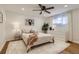 Bedroom features ceiling fan, wood floors, plush rug, and lots of natural light at 3376 Jasmine St, Denver, CO 80207