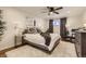 Cozy bedroom with plush rug, ceiling fan, and window with natural light at 3376 Jasmine St, Denver, CO 80207
