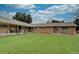 Multi-unit dwelling features a manicured front lawn, offering curb appeal and a welcoming exterior at 3376 Jasmine St, Denver, CO 80207