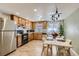 Charming eat-in kitchen boasts wood cabinets, offering ample storage and counter space at 3376 Jasmine St, Denver, CO 80207