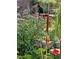 A black cat enjoys the shade in this home's lush backyard at 426 Buena Vista Rd, Golden, CO 80401