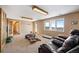 Spacious basement with exterior access, neutral colors, carpeted floors, and great natural light at 426 Buena Vista Rd, Golden, CO 80401