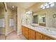 Bathroom featuring a double vanity with a large mirror and a separate shower at 426 Buena Vista Rd, Golden, CO 80401
