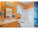 Bright bathroom featuring a vanity, toilet, and a bathtub with a shower at 426 Buena Vista Rd, Golden, CO 80401