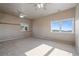Large bedroom with natural lighting, carpeted floors, and scenic views from both windows at 426 Buena Vista Rd, Golden, CO 80401