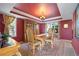 Elegant dining room featuring a wooden table, upholstered chairs, and a decorative ceiling with a chandelier at 426 Buena Vista Rd, Golden, CO 80401